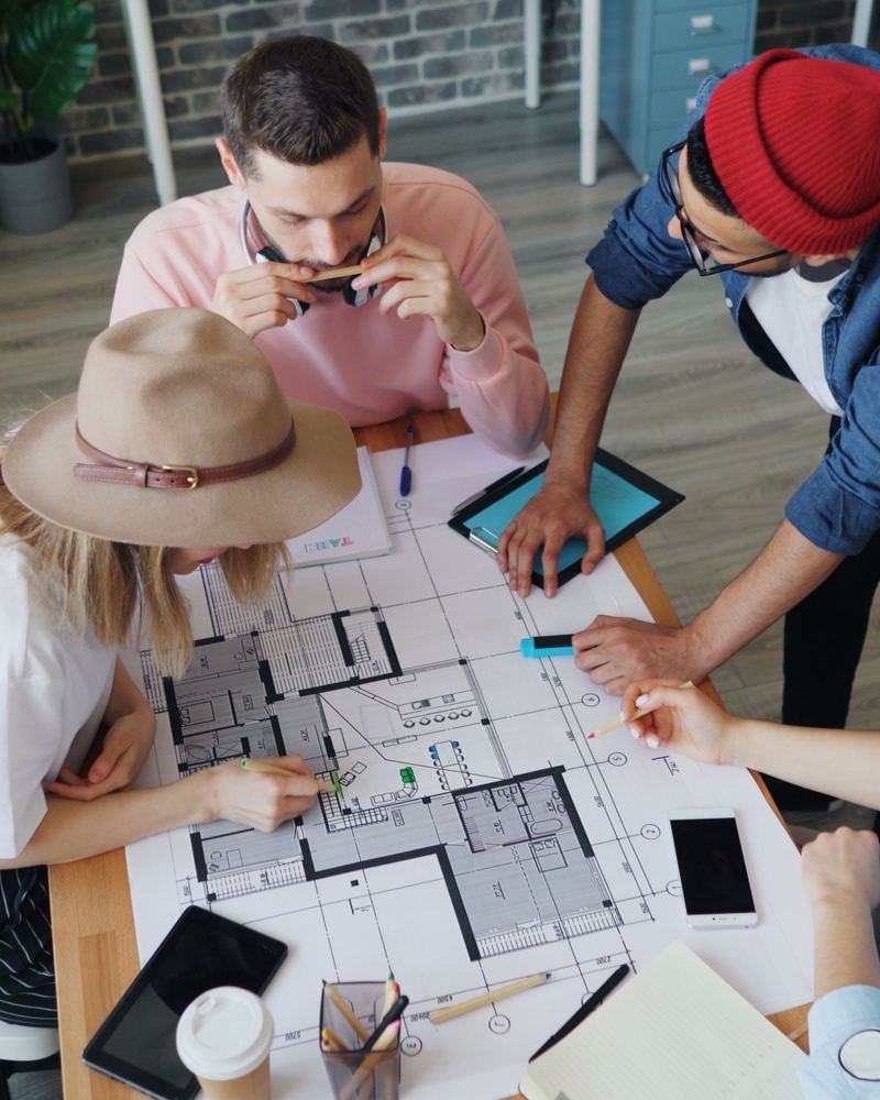 Small architecture team working in a daylit studio